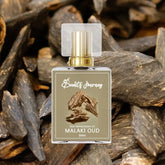 Malaki Oud perfume bottle with gold cap, surrounded by oud wood, premium fragrance for men and women