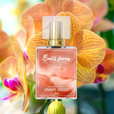 50ml perfume bottle with gold cap, pink label, and orchid flowers in the background