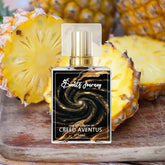 Perfume bottle with gold cap labeled 'Creed Aventus' in front of fresh sliced pineapples