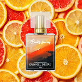 Perfume bottle labeled Dunhill Desire Impression with citrus slices background, 50ml