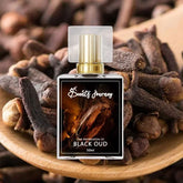Black Oud perfume bottle with gold cap on clove background, luxury fragrance for men and women